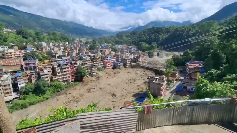 Insider_Paper_-_BREAKING_Moment_flash_floods_swept_away_several_houses_and_a_bridge_...